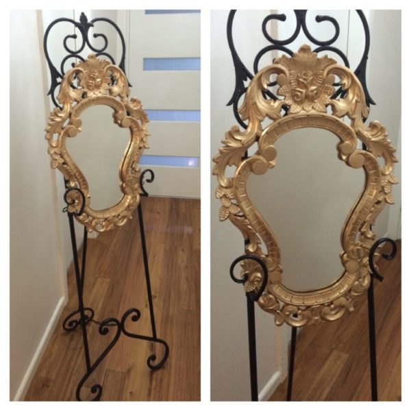 Gold ornate mirror on easel