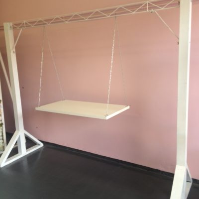 White arbor with cake swing