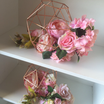 Rose gold candle holders with flowers