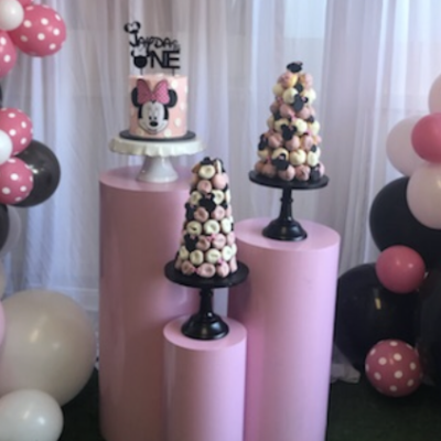 Set of three pink round acrylic plinths