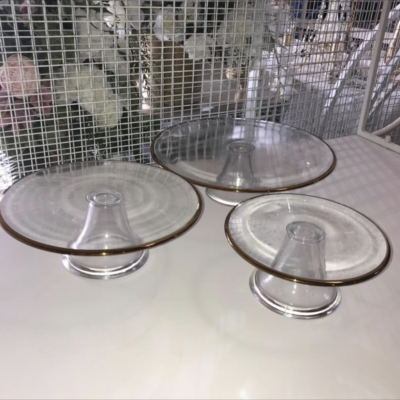 Set of three glass and gold trim cake stands