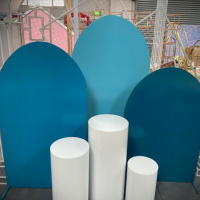 Set of three blue arches with white round plinths