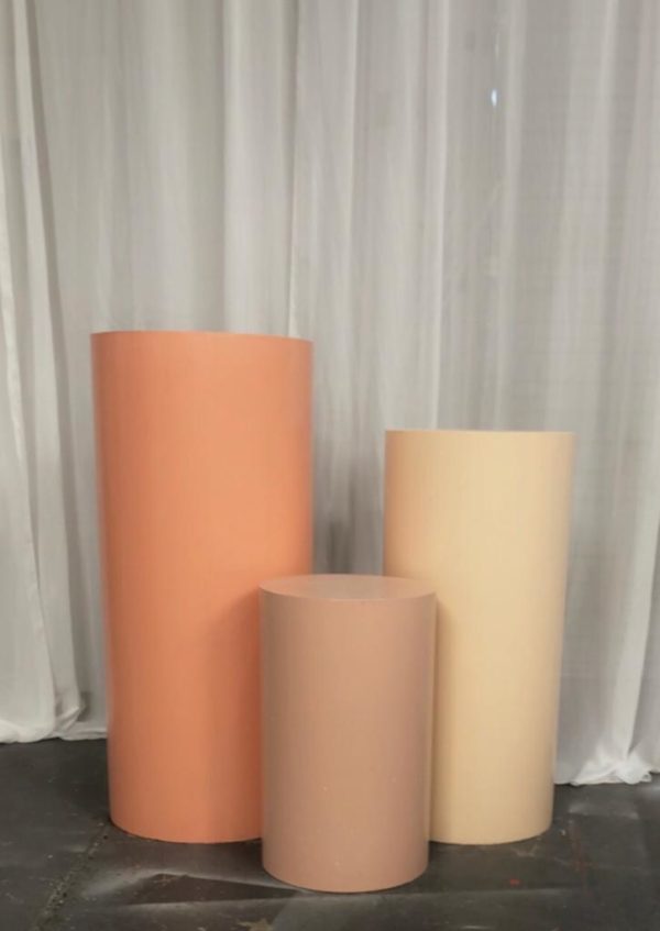 Set of three peach and nude round plinths