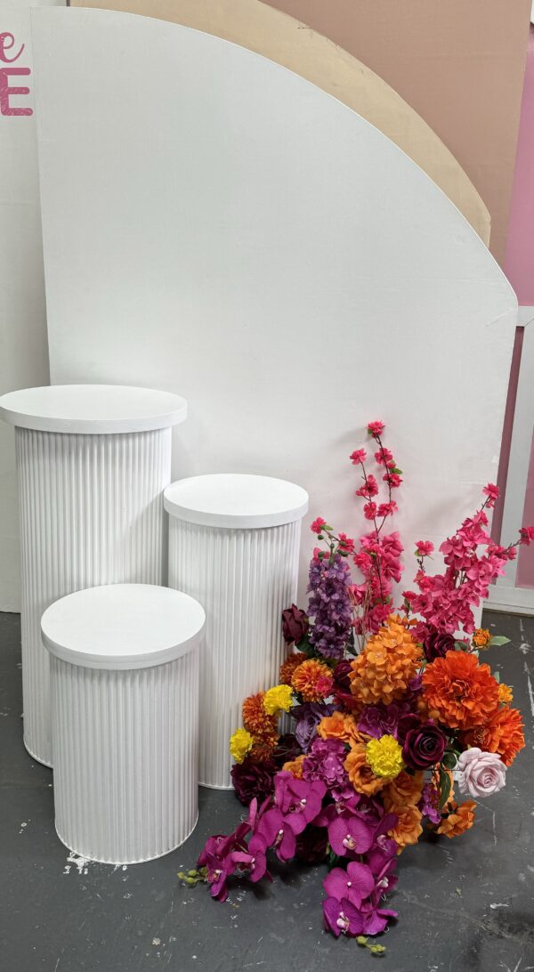 Set of three white ribbed plinths